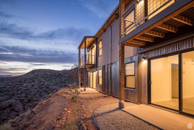 1185 S Murphy Ln Unit 201A, Moab, UT 84532 - property exterior at dusk featuring a balcony and a mountain view