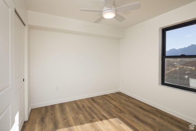 1185 S Murphy Ln Unit 201A, Moab, UT 84532 - spare room with wood finished floors, baseboards, and a ceiling fan