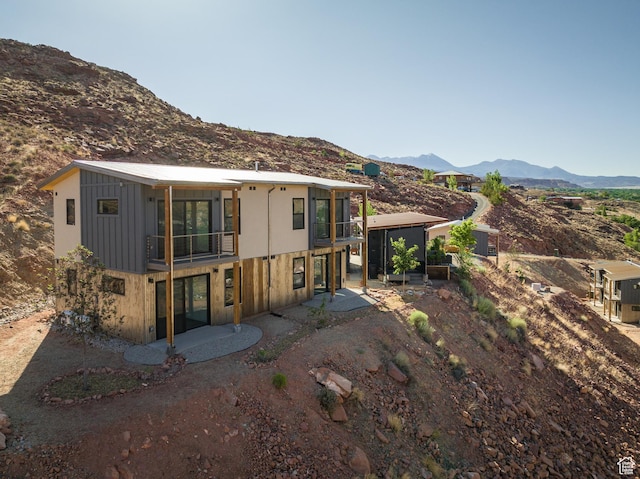 1185 S Murphy Ln Unit 201A, Moab, UT 84532 - rear view of house featuring a balcony, a mountain view, and a patio area