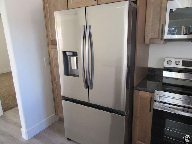 696 N Westridge Dr W Unit 2, St George, UT 84770 - kitchen with appliances with stainless steel finishes and light wood-type flooring