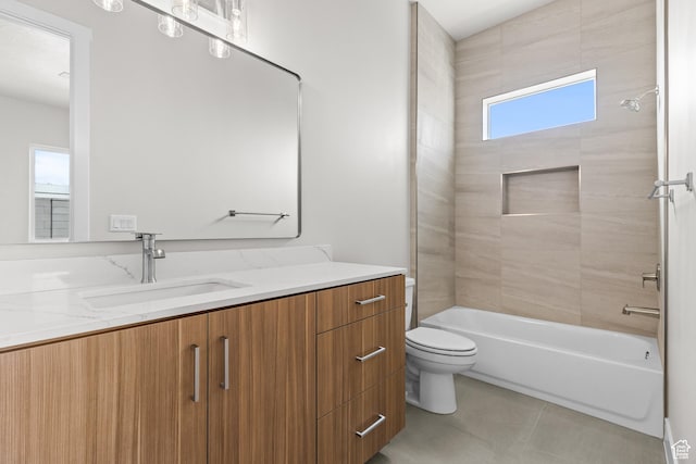 bathroom with tile patterned flooring, toilet, vanity, and shower / bathing tub combination