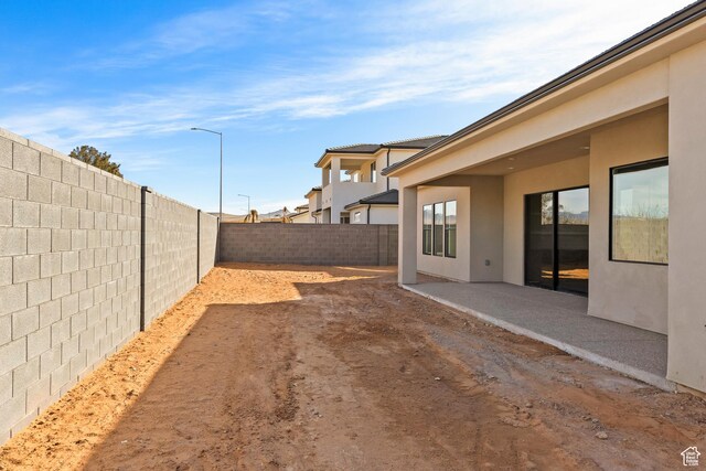 view of yard with a patio area and a fenced backyard