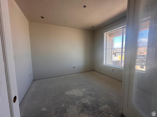 3997 W 1500 S, Hurricane, UT 84737 - empty room with unfinished concrete floors and a textured ceiling