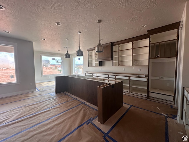 3997 W 1500 S, Hurricane, UT 84737 - kitchen featuring open shelves, a kitchen island, dark brown cabinetry, a textured ceiling, and recessed lighting