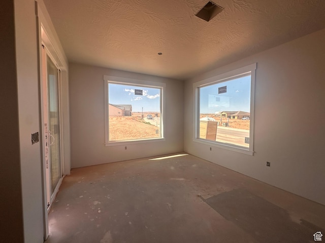 3997 W 1500 S, Hurricane, UT 84737 - empty room featuring concrete flooring and a textured ceiling