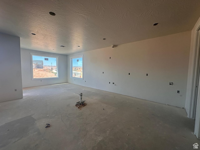 3997 W 1500 S, Hurricane, UT 84737 - unfurnished room with a textured ceiling and unfinished concrete floors
