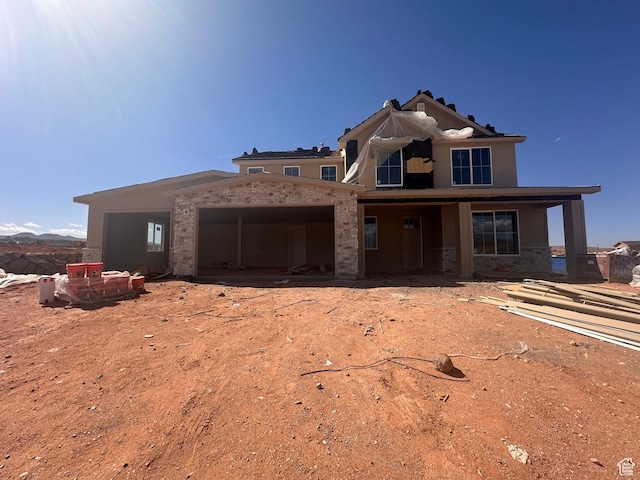 3997 W 1500 S, Hurricane, UT 84737 - view of front facade with an attached garage and stone siding