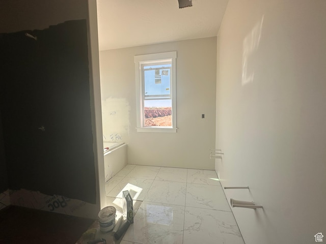 3997 W 1500 S, Hurricane, UT 84737 - full bathroom featuring marble look tile flooring and a bath