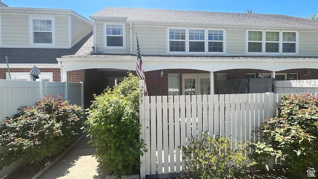 271 Brookfield Ln, Centerville, UT 84014 - view of front of home featuring fence, a porch, and brick siding