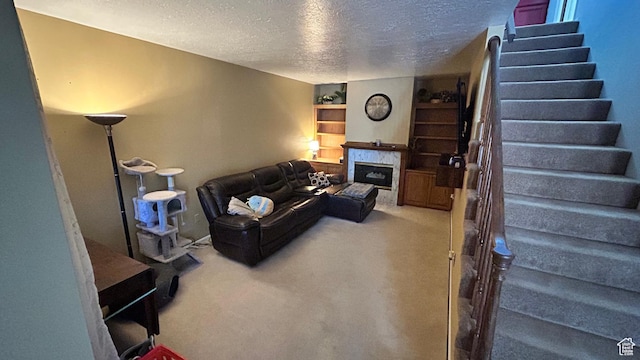 271 Brookfield Ln, Centerville, UT 84014 - living room with stairs, a textured ceiling, carpet floors, and a high end fireplace