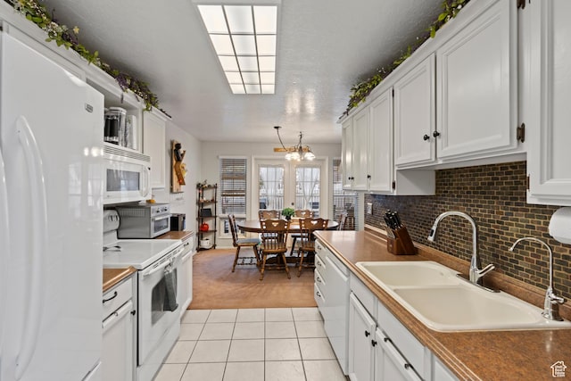 271 Brookfield Ln, Centerville, UT 84014 - kitchen featuring white appliances, white cabinetry, light carpet, and a sink