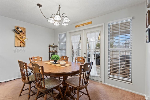 271 Brookfield Ln, Centerville, UT 84014 - dining space with french doors, baseboards, carpet flooring, and a chandelier