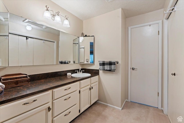271 Brookfield Ln, Centerville, UT 84014 - bathroom featuring vanity, baseboards, and a textured ceiling
