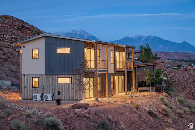 1185 S Murphy Ln Unit 201B, Moab, UT 84532 - back of house featuring ac unit, a mountain view, and a sunroom
