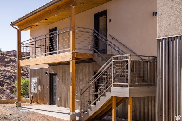 1185 S Murphy Ln Unit 201B, Moab, UT 84532 - view of side of property featuring stairs and stucco siding