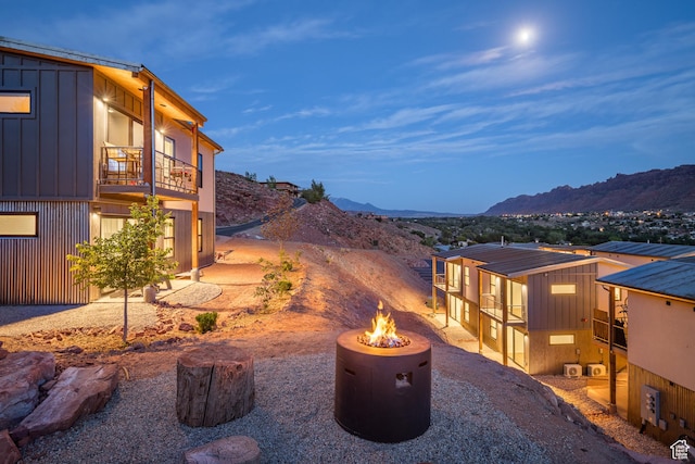 1185 S Murphy Ln Unit 201B, Moab, UT 84532 - view of patio with an outdoor fire pit, a balcony, and a mountain view