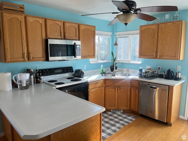 1401 W Green Hedge Way S, West Jordan, UT 84084 - kitchen with ceiling fan, stainless steel appliances, sink, and light wood-type flooring