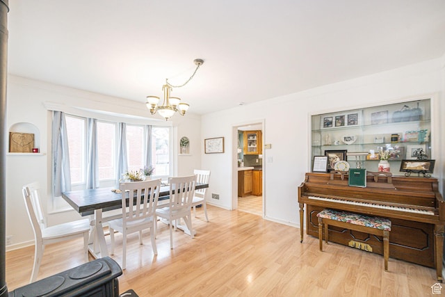41 N Center St, Wellsville, UT 84339 - dining space featuring an inviting chandelier and light hardwood / wood-style floors