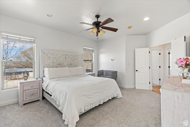 carpeted bedroom with ceiling fan