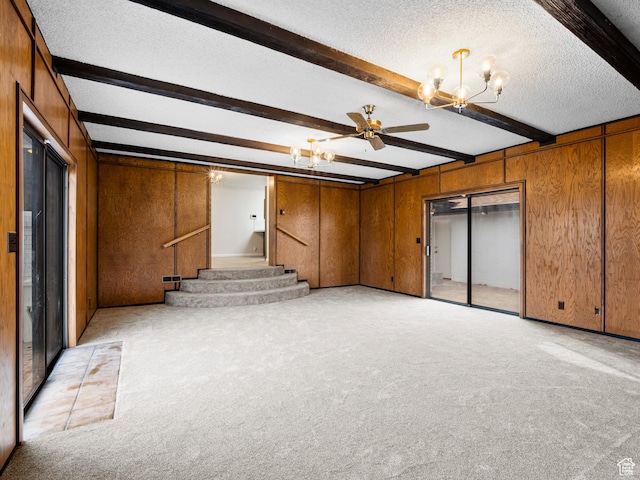 575 E 500 N, Pleasant Grove, UT 84062 - unfurnished living room featuring wooden walls, light carpet, beamed ceiling, stairs, and ceiling fan with notable chandelier