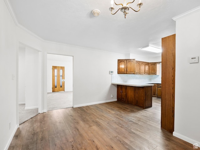 575 E 500 N, Pleasant Grove, UT 84062 - kitchen featuring a peninsula, light countertops, a chandelier, and wood-type flooring