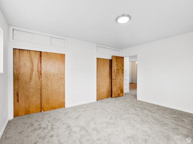 575 E 500 N, Pleasant Grove, UT 84062 - unfurnished bedroom featuring two closets, baseboards, and carpet flooring