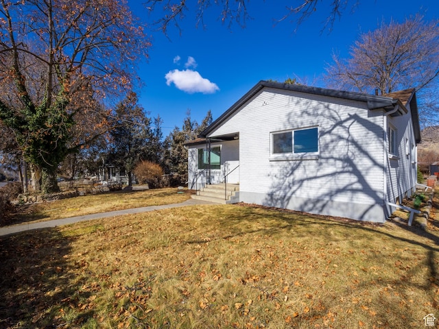 575 E 500 N, Pleasant Grove, UT 84062 - exterior space featuring brick siding and a yard