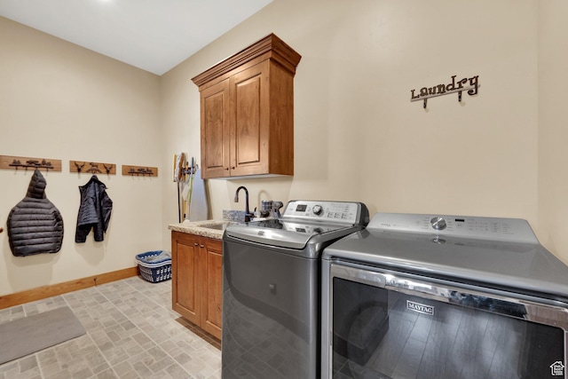 9284 E Tree Top Cir Unit 856, Heber City, UT 84032 - laundry room featuring washer and clothes dryer, baseboards, and cabinet space