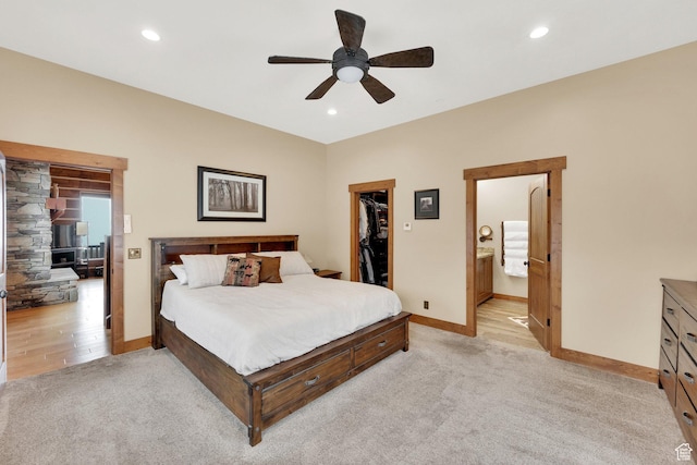 9284 E Tree Top Cir Unit 856, Heber City, UT 84032 - bedroom featuring light colored carpet, a spacious closet, baseboards, recessed lighting, and ensuite bath