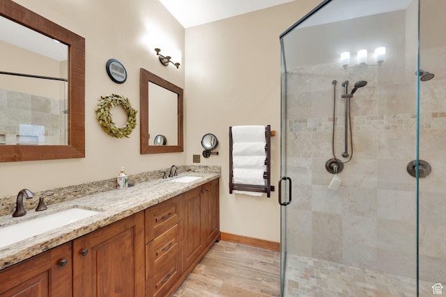 9284 E Tree Top Cir Unit 856, Heber City, UT 84032 - full bath with a stall shower, double vanity, wood finished floors, and baseboards