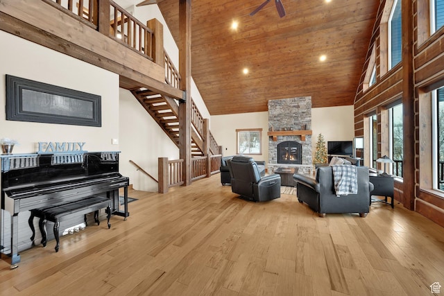 9284 E Tree Top Cir Unit 856, Heber City, UT 84032 - living area with high vaulted ceiling, light wood finished floors, a fireplace, stairway, and wooden ceiling