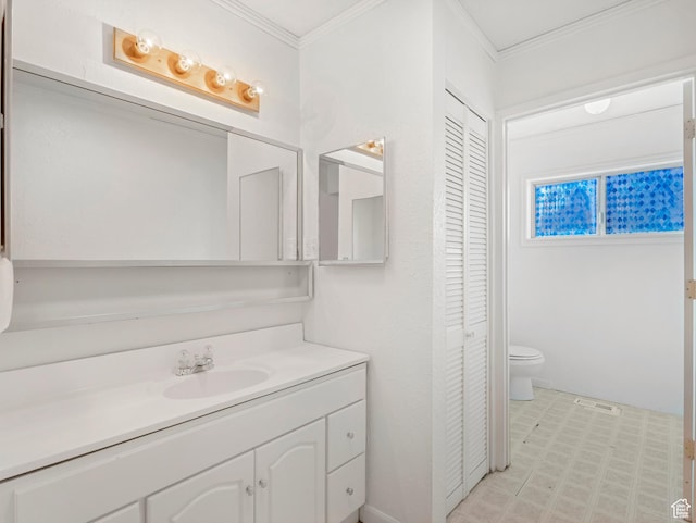 bathroom featuring ornamental molding, toilet, and vanity