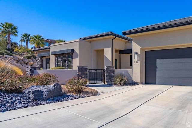 view of front of property with a garage