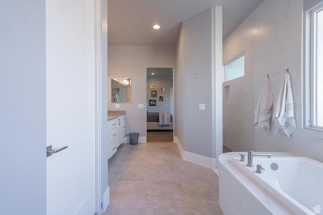 bathroom with vanity and separate shower and tub