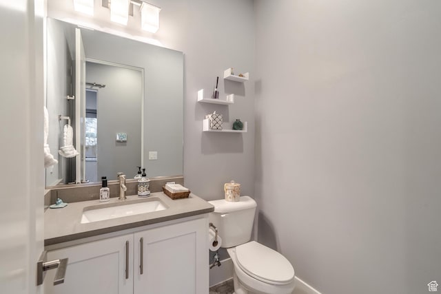 bathroom with vanity and toilet