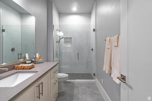 bathroom with vanity, tile patterned flooring, a shower with shower door, and toilet