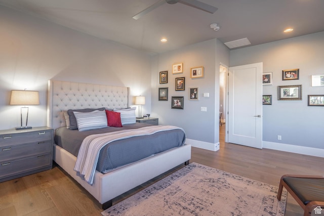 bedroom featuring hardwood / wood-style floors and ceiling fan