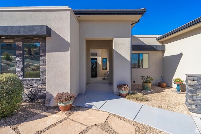 property entrance featuring a patio