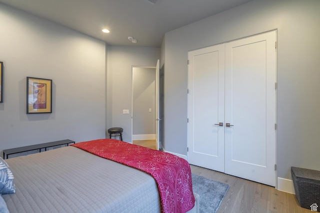 bedroom featuring a closet and light hardwood / wood-style flooring