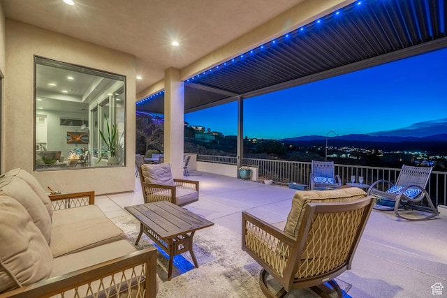 view of patio with a mountain view and an outdoor hangout area