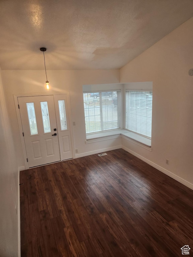 548 S 675 W, Centerville, UT 84014 - entryway featuring vaulted ceiling, a textured ceiling, and dark hardwood / wood-style flooring