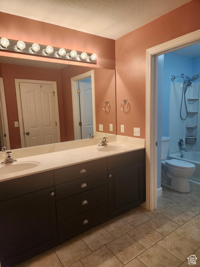 548 S 675 W, Centerville, UT 84014 - bathroom featuring vanity, bathing tub / shower combination, tile patterned flooring, and a textured ceiling