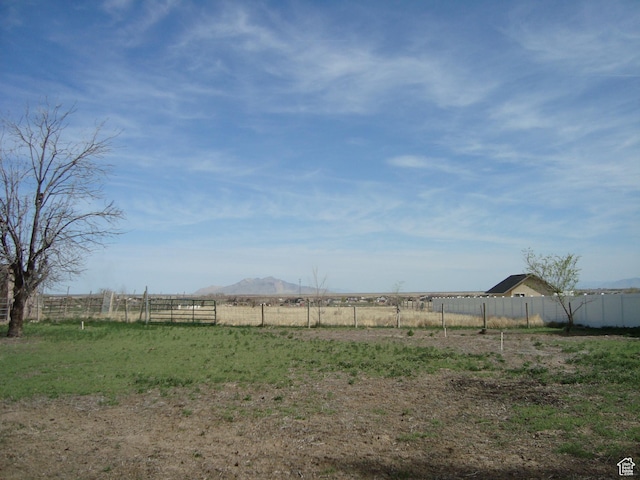 500 W Clark St S, Grantsville, UT 84029 - view of yard with a rural view, fence, and a mountain view