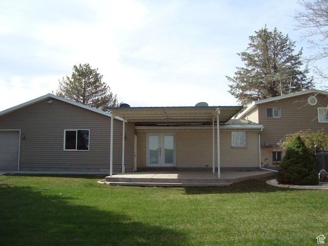 500 W Clark St S, Grantsville, UT 84029 - back of house featuring a lawn and french doors
