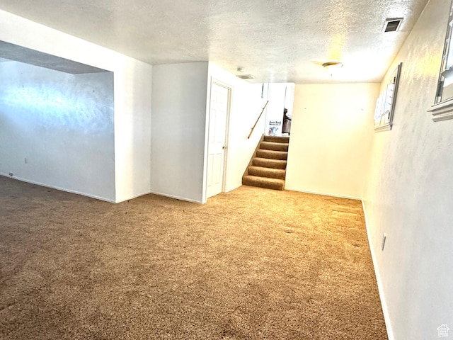 500 W Clark St S, Grantsville, UT 84029 - finished basement featuring carpet floors, a textured ceiling, visible vents, and stairway