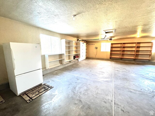 500 W Clark St S, Grantsville, UT 84029 - garage featuring freestanding refrigerator