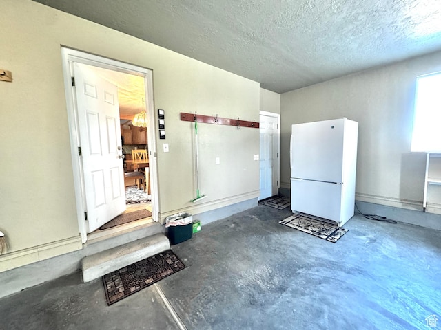 500 W Clark St S, Grantsville, UT 84029 - misc room featuring unfinished concrete flooring and a textured ceiling
