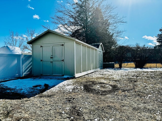 500 W Clark St S, Grantsville, UT 84029 - snow covered structure featuring an outbuilding, fence, and a storage shed