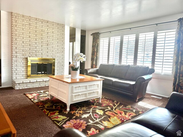 500 W Clark St S, Grantsville, UT 84029 - carpeted living room with baseboards, visible vents, a fireplace, and a wealth of natural light