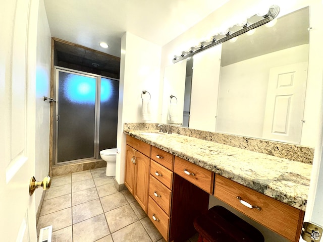 500 W Clark St S, Grantsville, UT 84029 - full bath featuring visible vents, a shower stall, vanity, tile patterned floors, and toilet